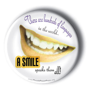 There Are Hundreds Of Languages In The World. A Smile Speaks Them All! - Button/Magnet